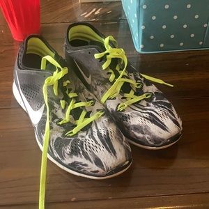 Tennis shoes white and black with green laces